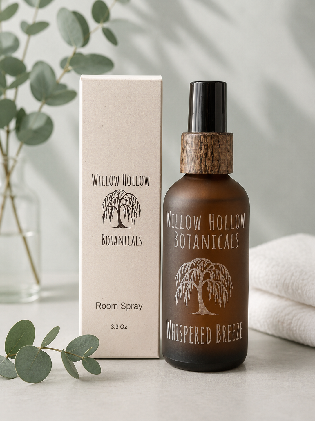 Willow Hollow Botanicals Whispered Breeze luxury room spray featuring eucalyptus, white linen, and crisp mint notes in a frosted amber glass bottle with sustainable packaging.