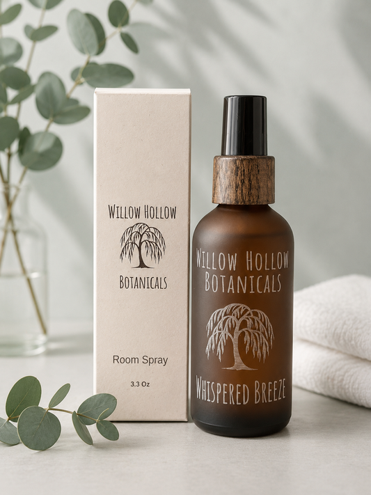 Willow Hollow Botanicals Whispered Breeze luxury room spray featuring eucalyptus, white linen, and crisp mint notes in a frosted amber glass bottle with sustainable packaging.