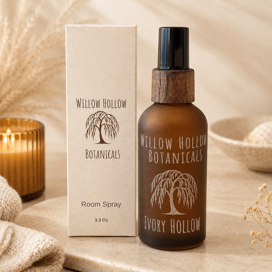 Willow Hollow Botanicals Ivory Hollow luxury room spray featuring warm amber and vanilla notes in a frosted amber glass bottle with sustainable packaging.