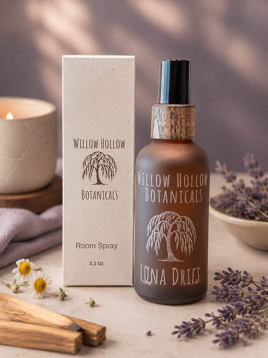 Willow Hollow Botanicals Luna Drift luxury room spray featuring lavender, Roman chamomile, and sandalwood notes in a frosted amber glass bottle with sustainable packaging.